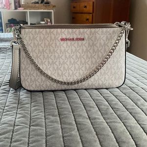 moving and need to clear out my closet! barely used micheal kors multi use bag